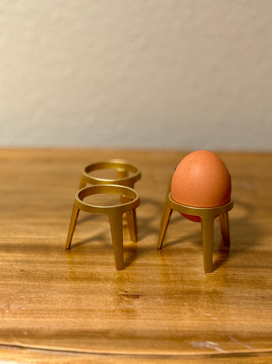 Vier goldene Eierbecher von Sebastian Frank – stilvoll & edel